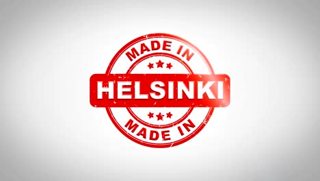 made in helsinki signed stamping text wooden stamp animation. red ink on clean white paper surface background with green matte background included.