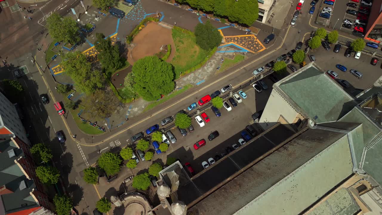 Overhead aerial video of St Anne's Cathedral in the Cathedral Quarter in Belfat City Centre, Northern Ireland on a bright and sunny day. Filmed in 4K, 60FPS and with Rec709 Color.