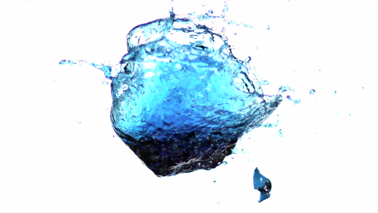 Arrow shooting through water balloon on white background