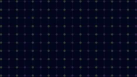 symmetrical pattern of green and purple dots on black background