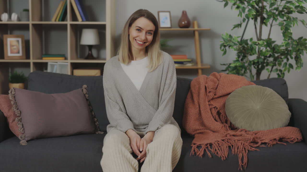 Woman sitting on a sofa in a living room