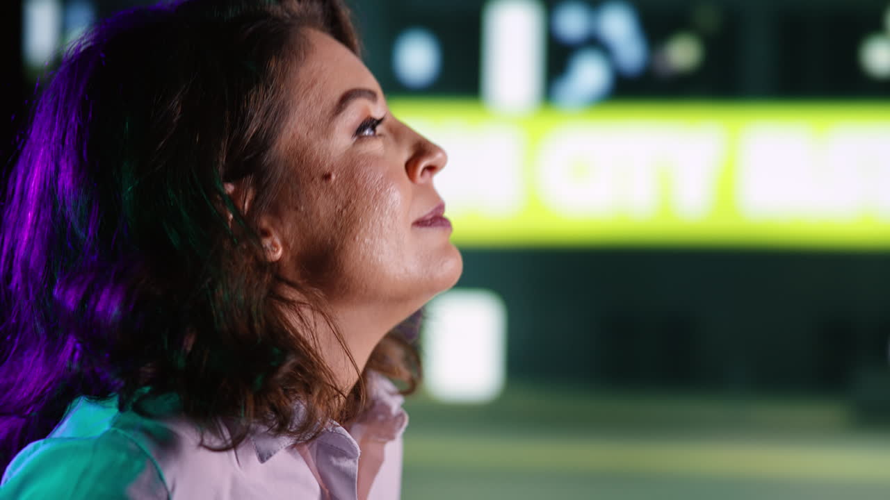Casual woman walks on road at night time