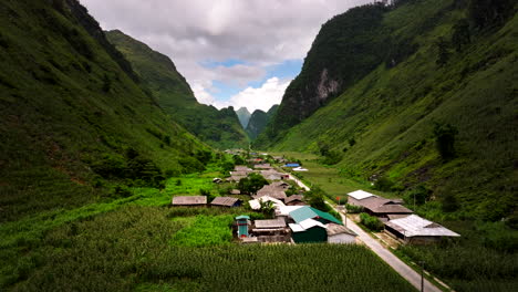 aerial view of traditional homes in lush valley, yen minh, vietnam