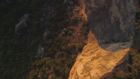 aerial view of mountainous landscape with cliffs and valley