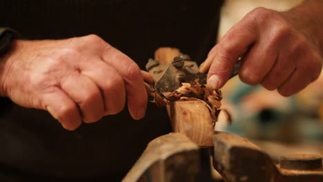 boat building, shaping decorative teak wood trim by hand