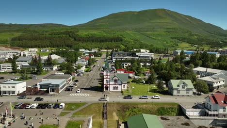 wooden-church-Húsavíkurkirkja-in-Husavik-Iceland-aerial-shot-sunny-day