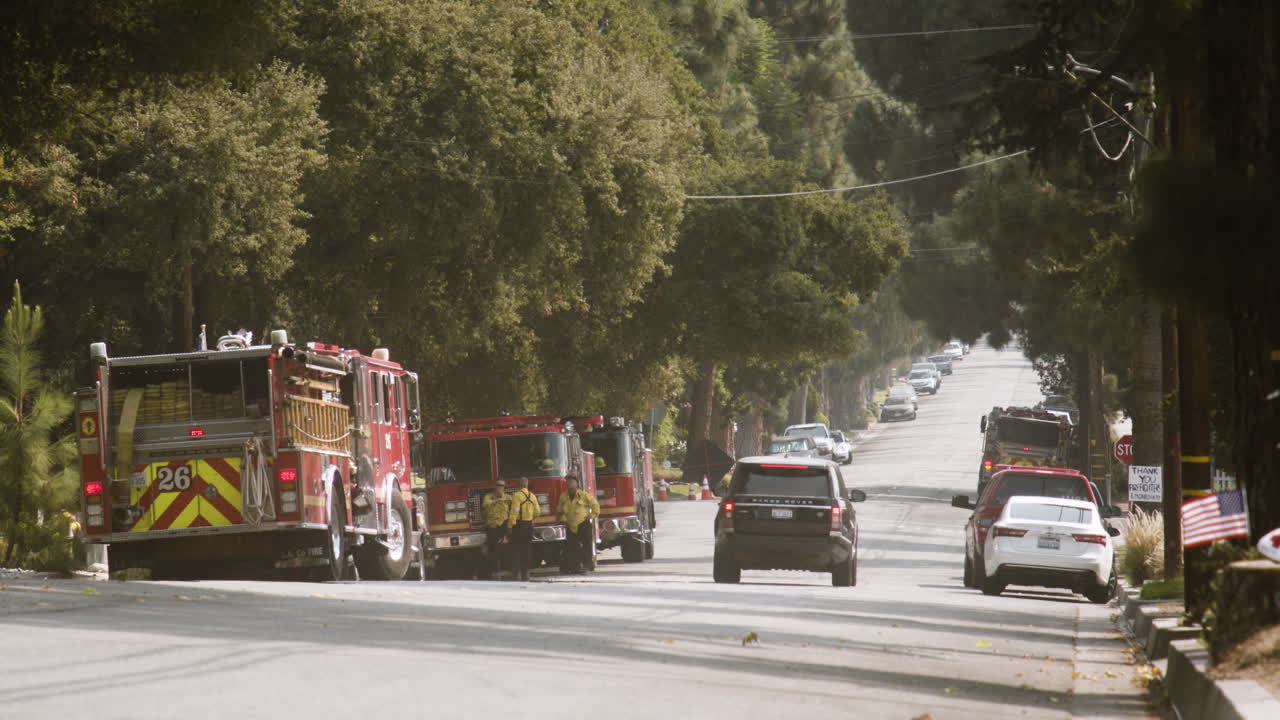 Fire trucks and emergency personnel on a residential street