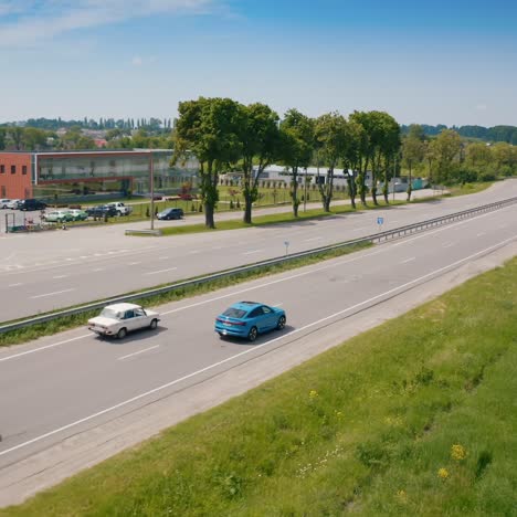 New fulle electric Audi on road. Audi is driving on the outskirts of town