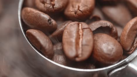 close up of seeds of coffee. fragrant coffee beans are roasted smoke comes from coffee beans.