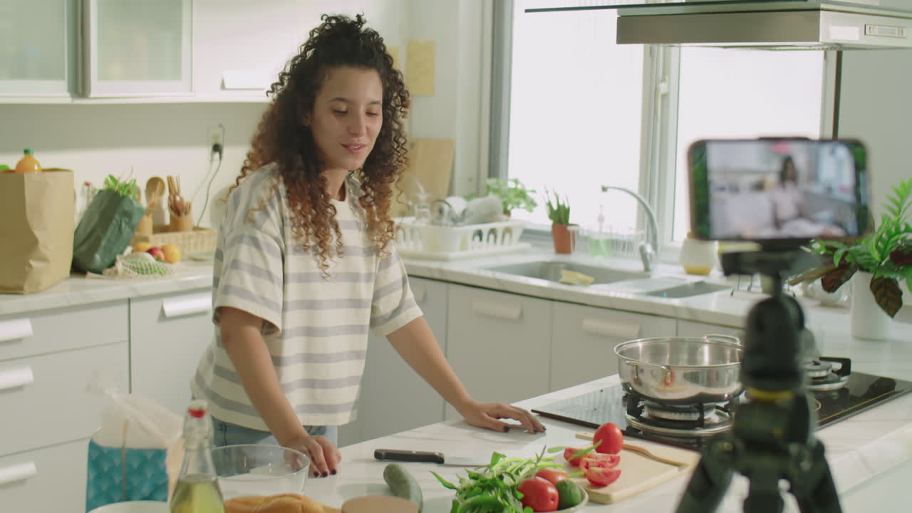 Girl Filming Cooking Vlog in Kitchen at Home