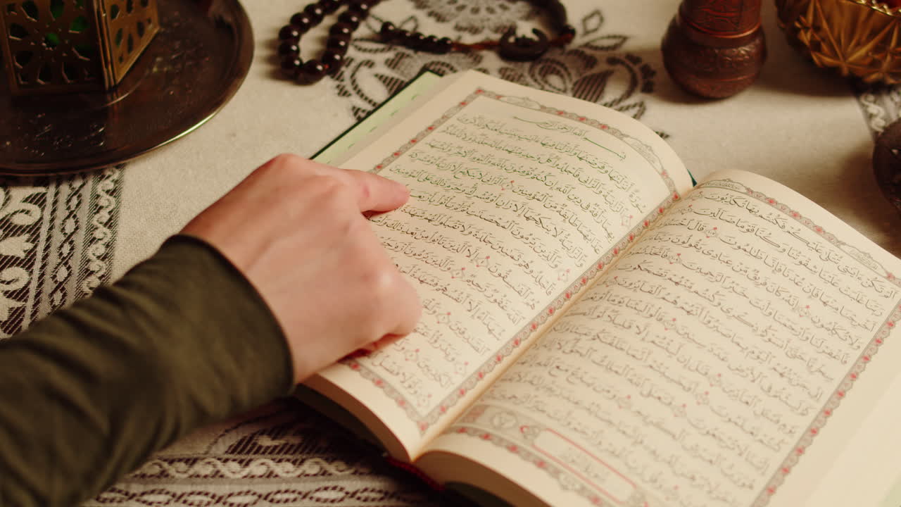 Quran book close-up, praying, islamic religion. Religious holiday Ramadan, holy month. Worship, making traditional prayer to God