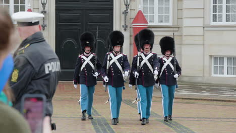 changing of guards at amalienborg - royal life guards marching in copenhagen, denmark. - wid shot