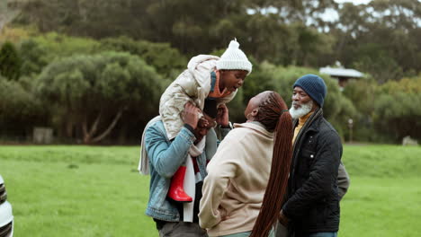 father, kiss or child in park with mother