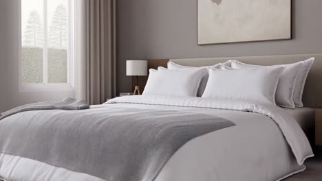 modern bedroom with white bedding and grey throw