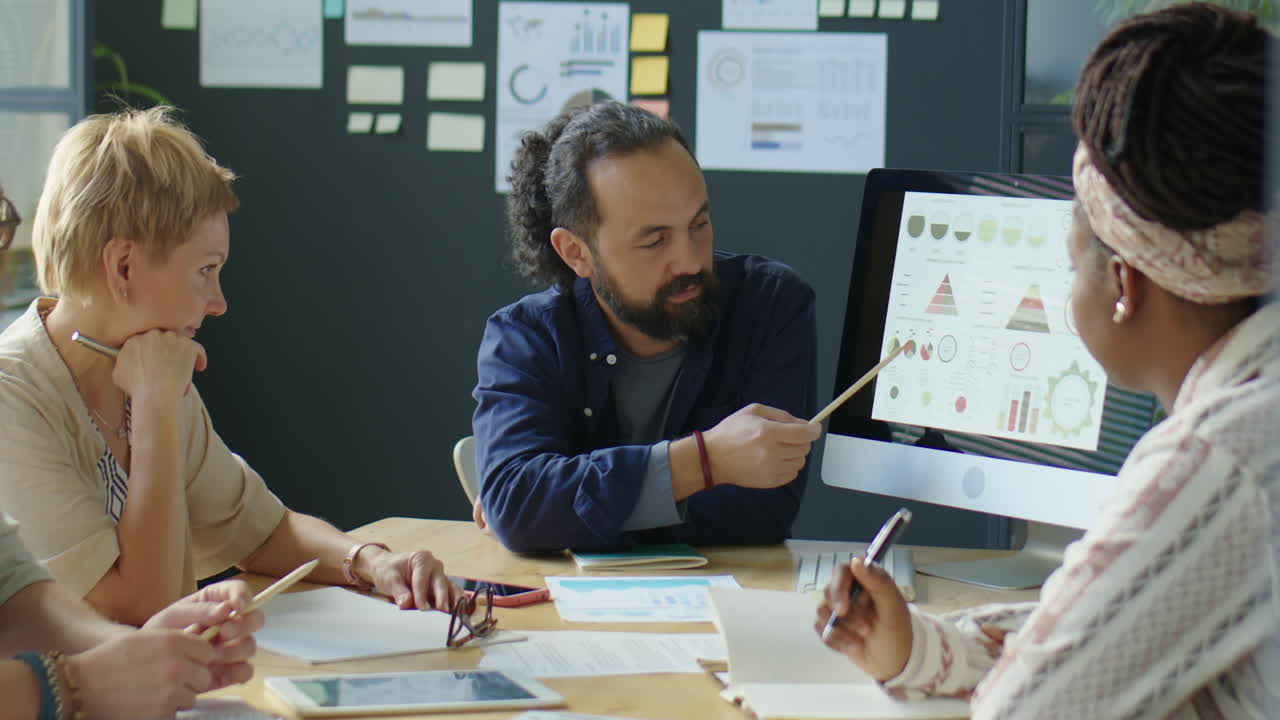 Businessman Talking with Team on Meeting
