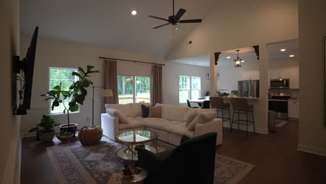 reveal shot of a family living room at a newly built house in the afternoon