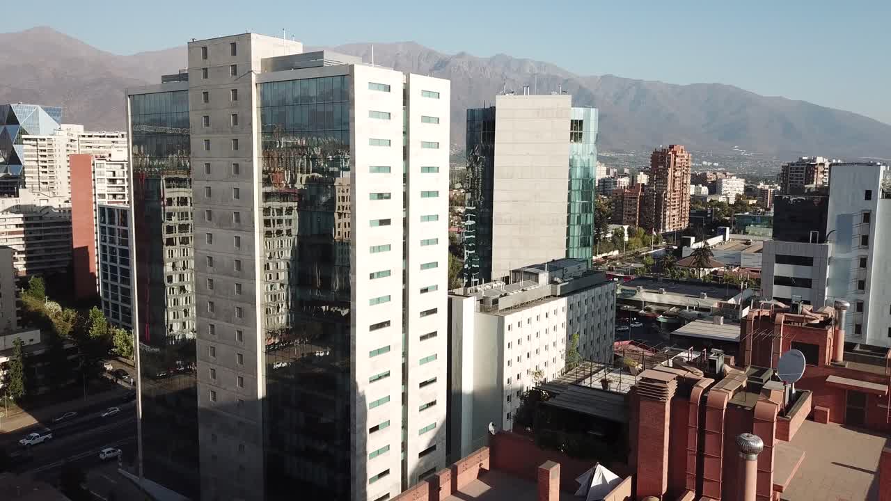 Santiago de Chile, Drone Aerial View of Modern Upscale Las Condes Neighborhood on Sunny Evening