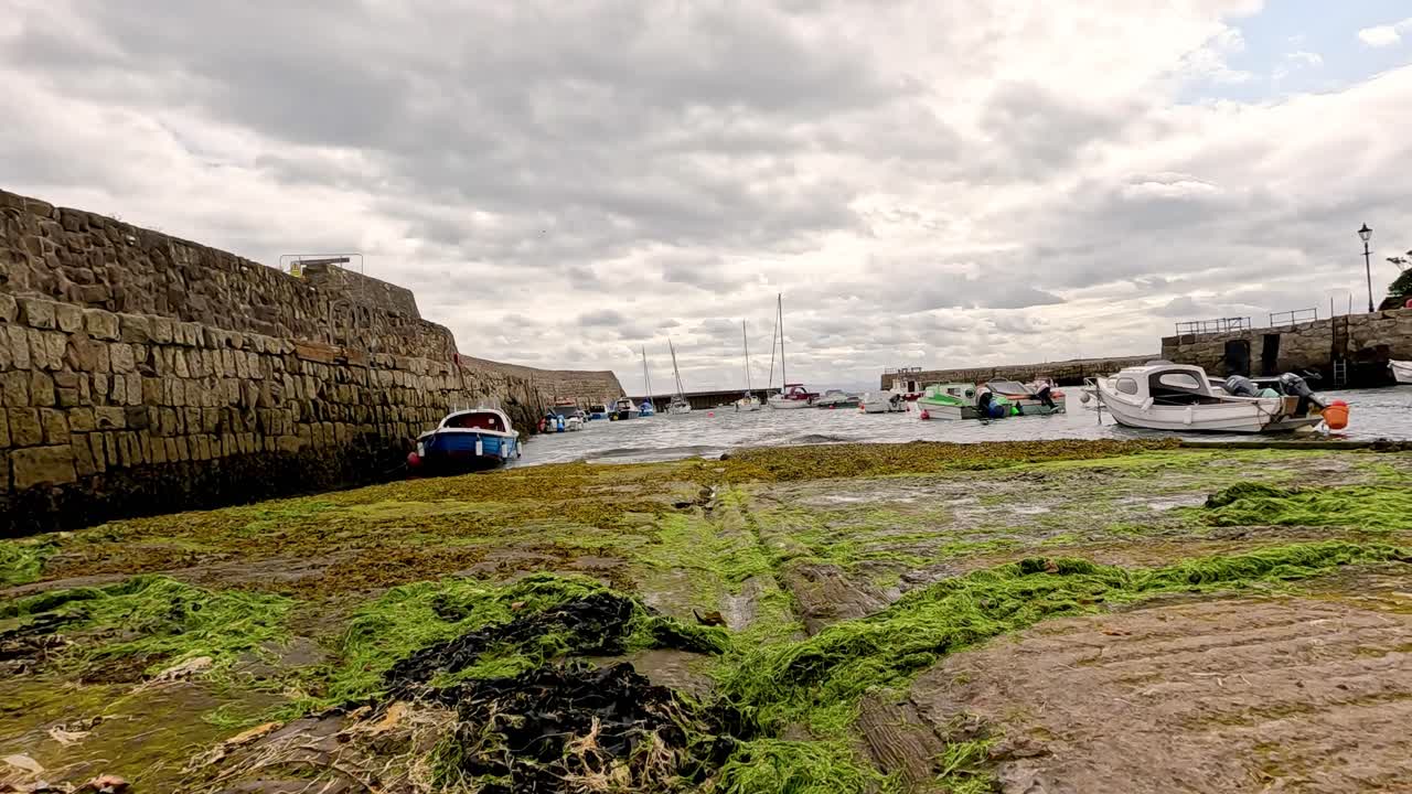 Boat nearing pier in Fife, Scotland