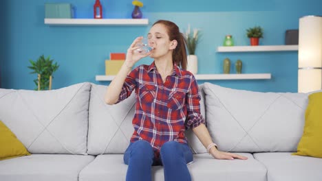 The-sick-young-woman-drinks-a-lot-of-water.