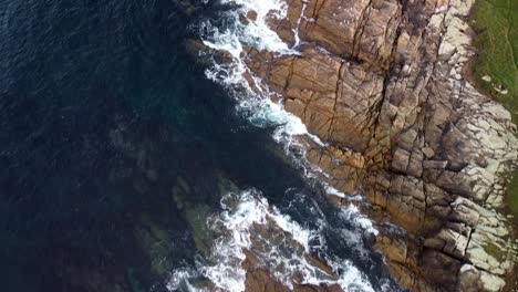 Scenic-View-Of-Ocean-Waves-Crashing-Against-Rocky-Shore-Of-A-Beach-In-Arteixo,-Spain