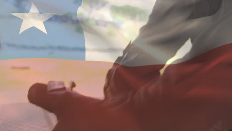 silhouette with rifle in front of chilean flag, creating dramatic animation effect