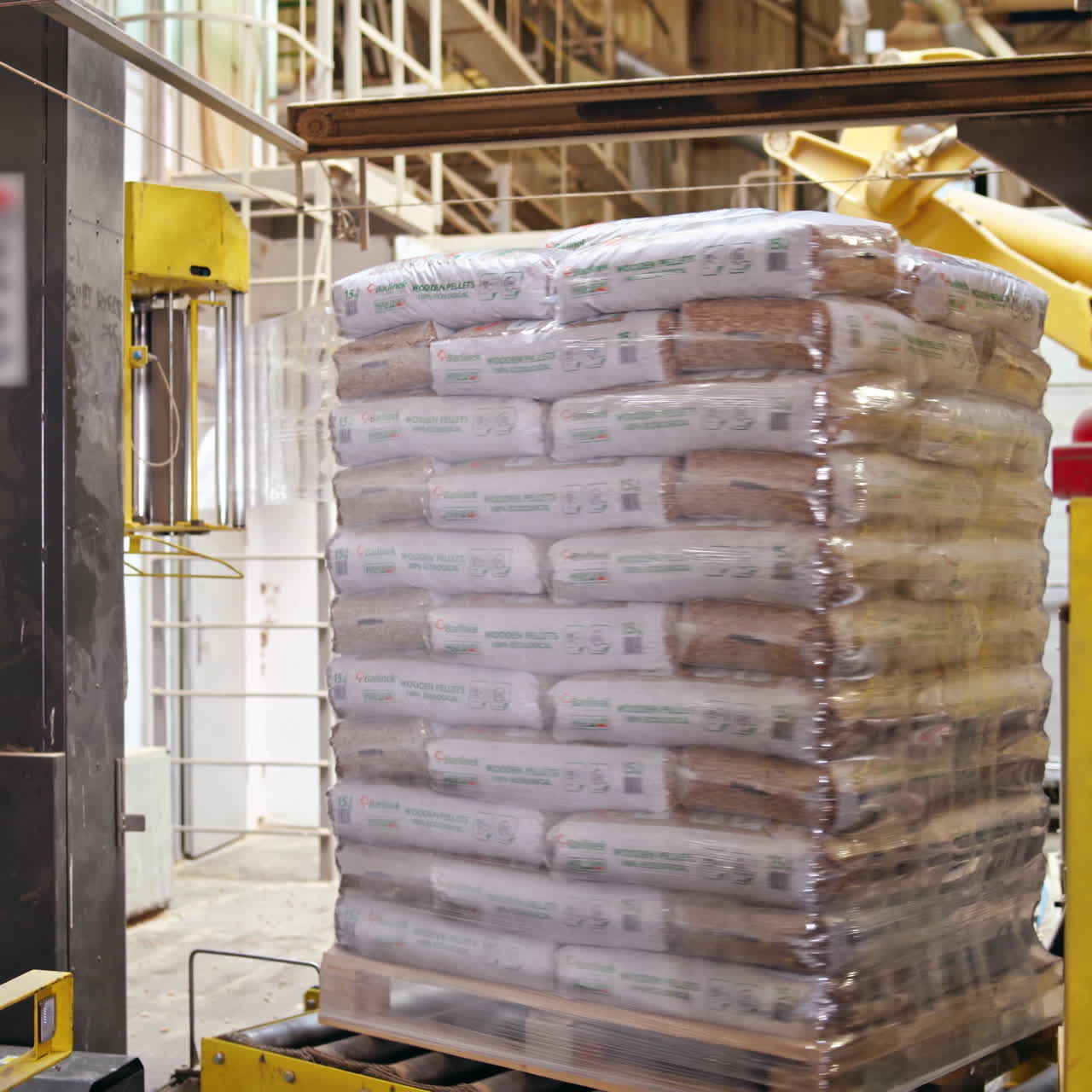 Shipping boxes wrapped in plastic shrink. Goods on a wooden pallet.