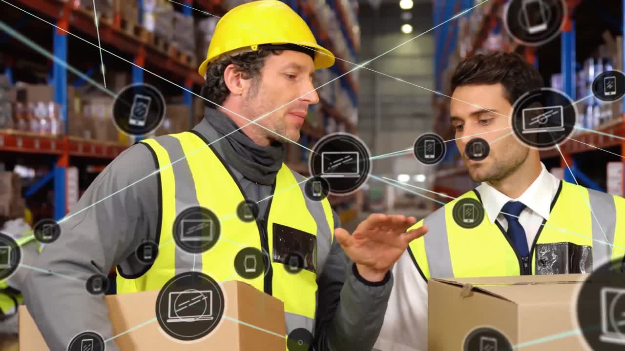 Animation of network of icons on caucasian male supervisor and worker discussing at warehouse