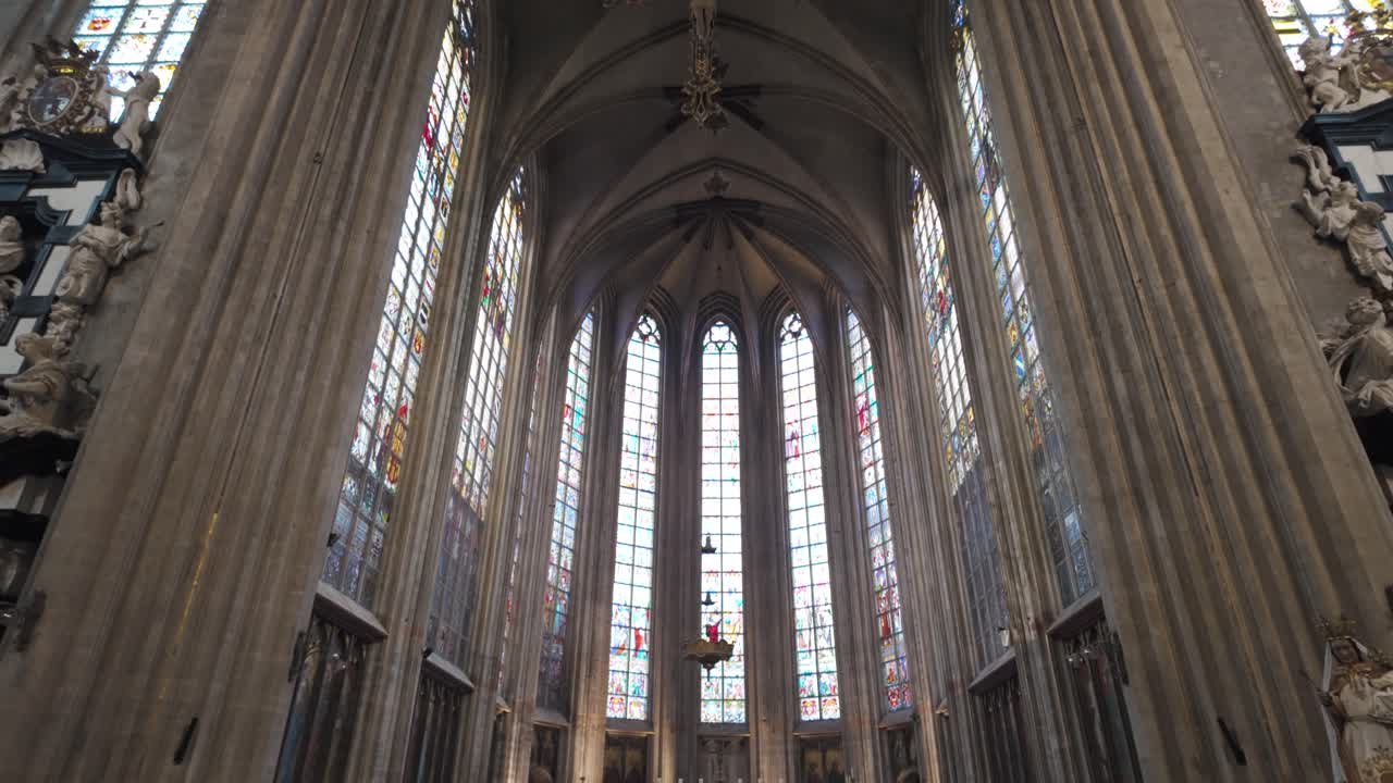 Stunning Gothic arches and stained glass inside the Church of Our Lady at the Sablon, Brussels