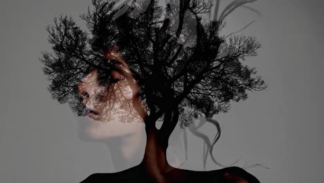 double exposure portrait of a woman with trees