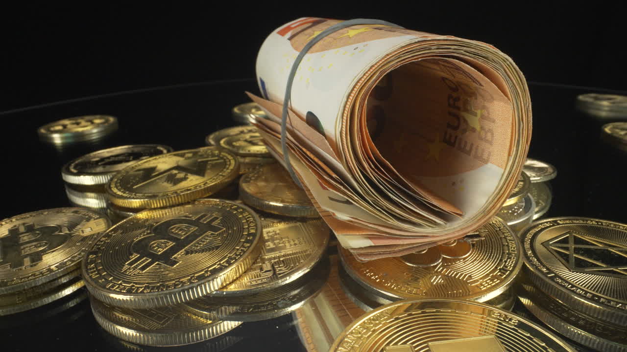 Zooming out of a slow turning macro view of rolled up cash, paper money euros on cryptocurrency coins with black background, 4K shot