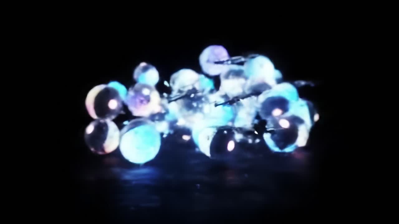 A captivating visual exploration of illuminated spheres and drones in a dark environment, showcasing stunning glowing elements that create a mesmerizing, otherworldly atmosphere