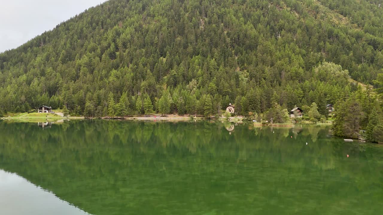 4K High resolution aerial drone video of the beautiful town of Champex Lac Switzerland one of the gems that the TMB- Tour du Mont Blanc goes through with small houses and a beautiful lake