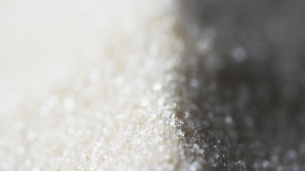 vídeo de primer plano de los granos de arena y copia del fondo del espacio