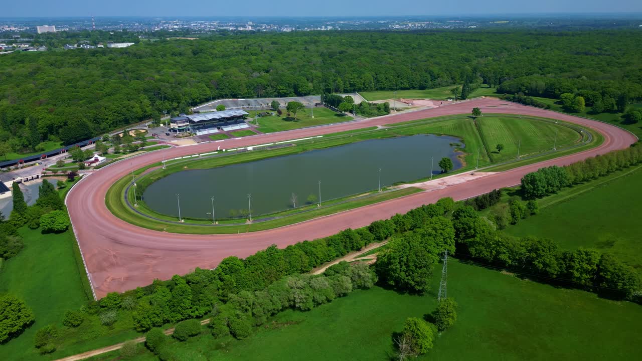 Hippodrome de Laval racecourse and surrounding area in Laval, Mayenne in France. Ideal for sports and leisure content. Aerial drone sideways