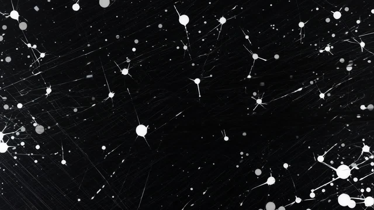 Abstract black and white splatter pattern, resembling a starry night
