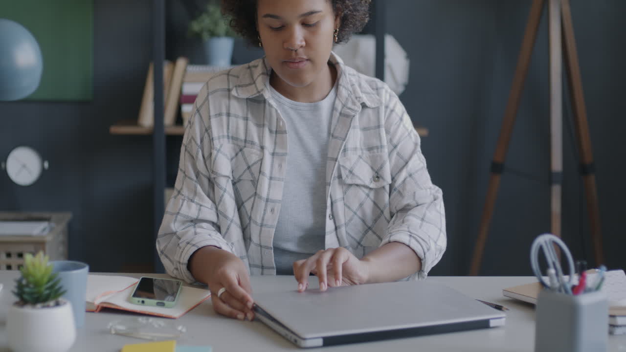 Woman Working on Laptop in Home Office