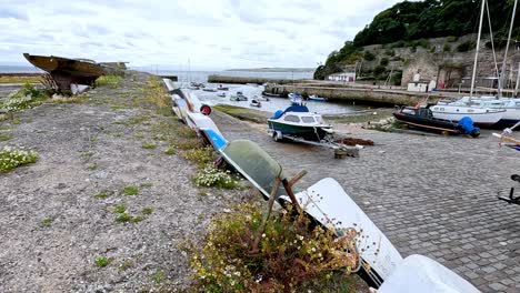 boats docked along a stone path