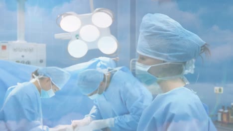 animation of clouds and sky over surgeons wearing face masks in hospital