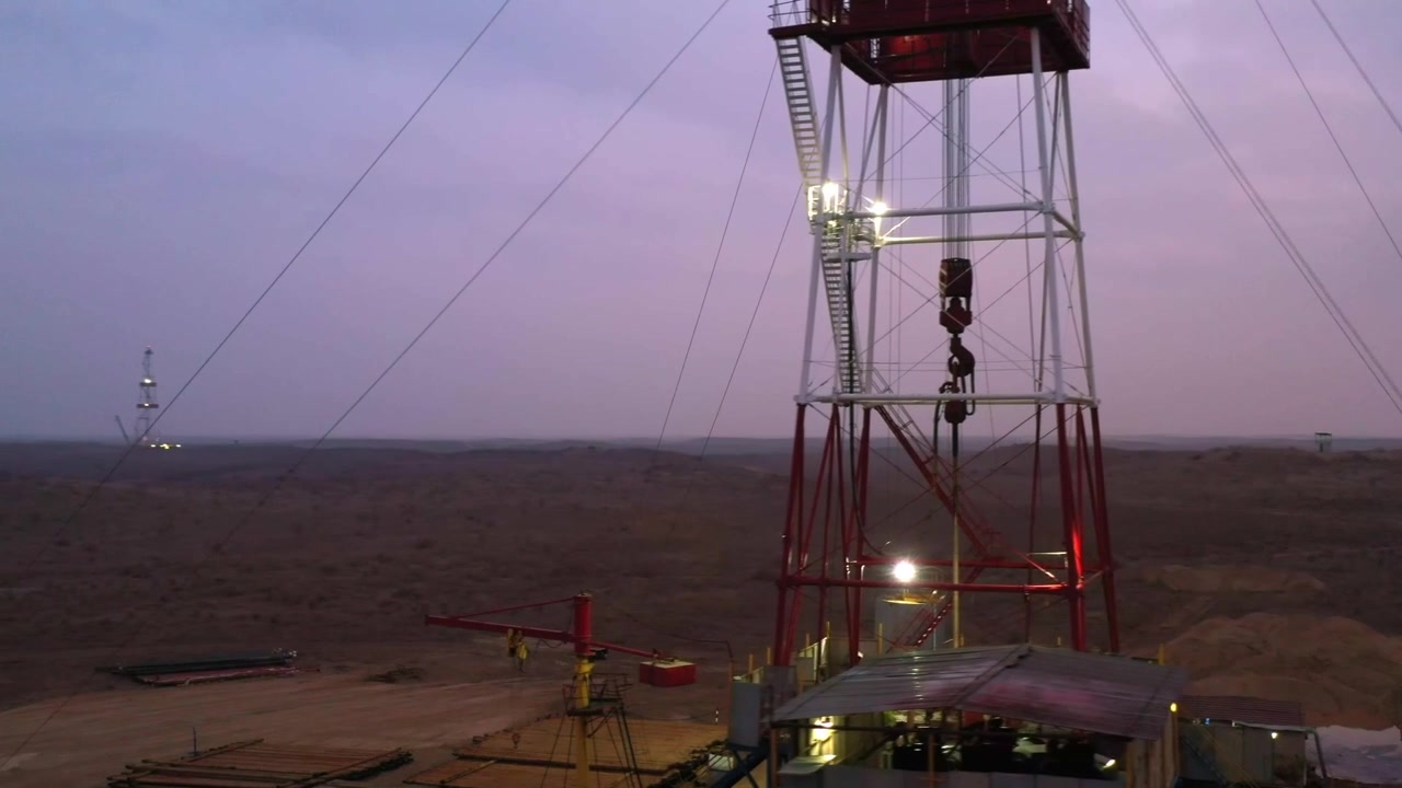 Close view of oil drilling rig structure in industrial gas field.