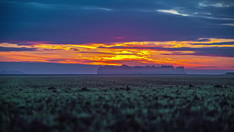 golden sunrise to fiery red sunset over rural fields