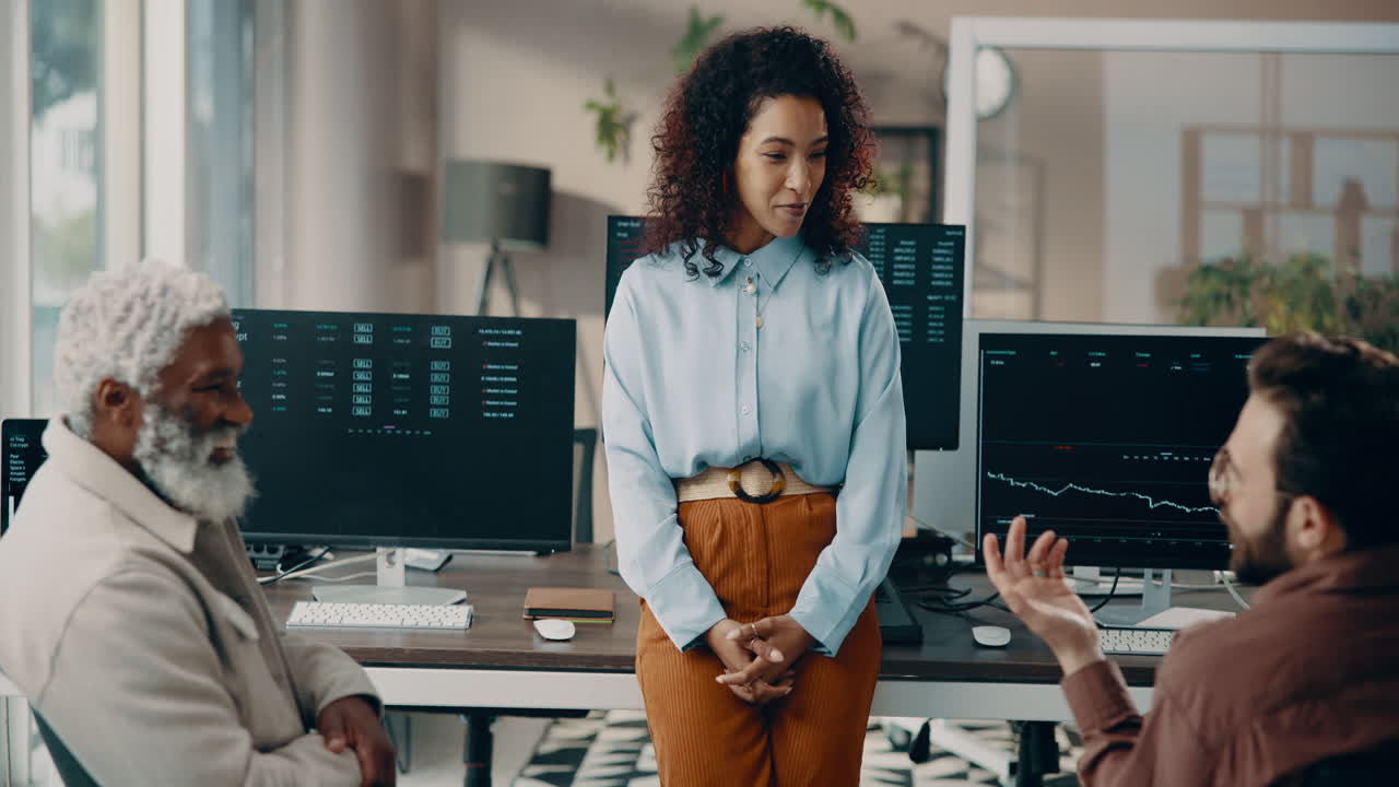 Team Discussing Stock Trading in Office