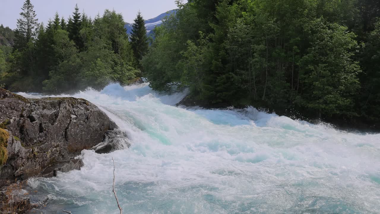 Mountain River Beautiful Nature Norway natural landscape. Lovatnet lake (also Loenvatnet) is a lake in the municipality of Stryn in Vestland county, Norway.