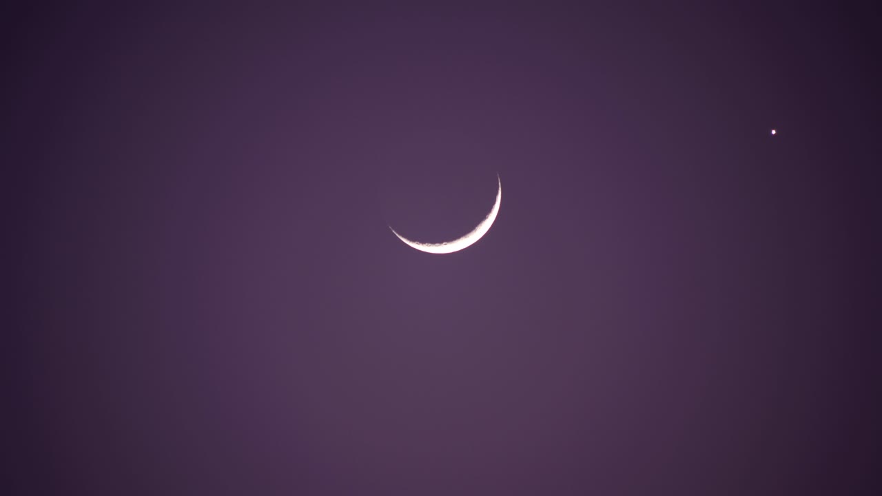 Crescent Moon and Star in Purple Night Sky