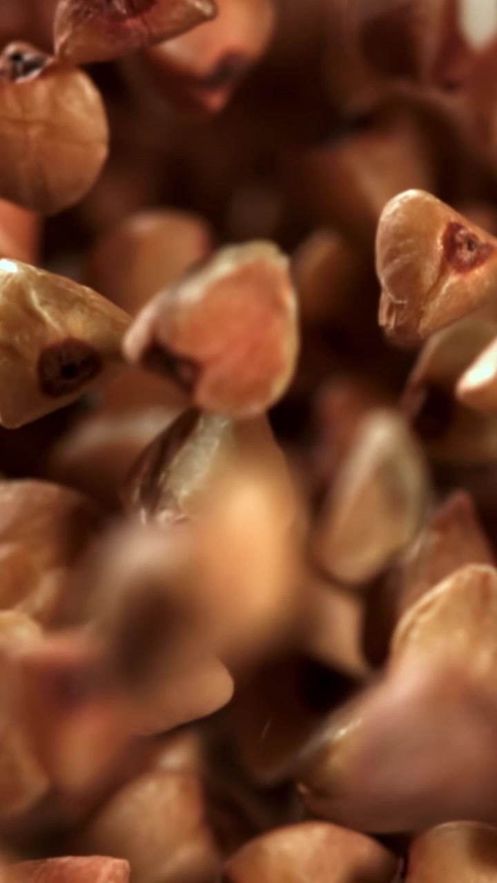 Raw Buckwheat Grains Falling in Super Slow Motion