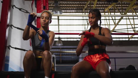 Two-mixed-race-women-wrapping-their-hands