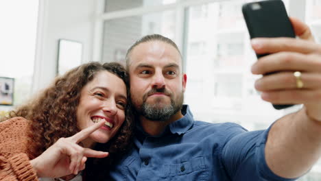 comic couple taking funny selfie with phone