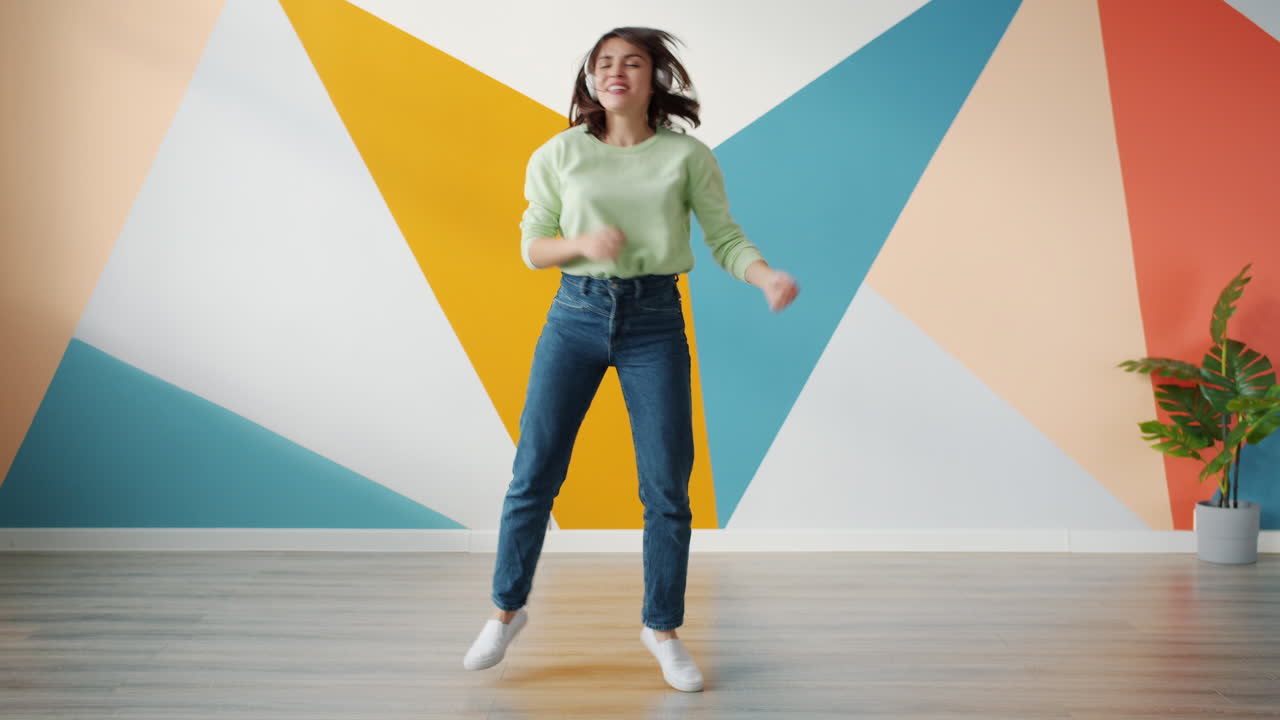 Woman Dancing and Enjoying Music