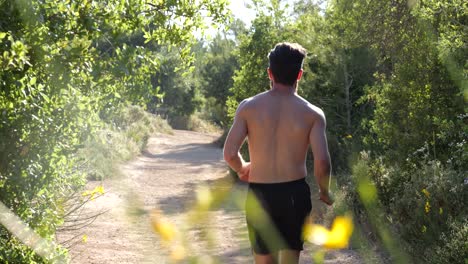 Shot-of-bearfoot-runner-in-the-morning-on-the-urban-forest-trail