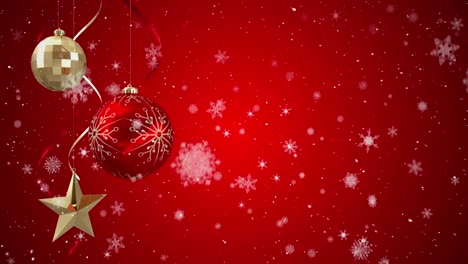 Animation-of-snow-falling-over-red-and-gold-christmas-baubles-decoration