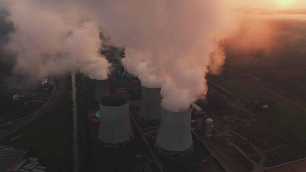 Power Plant with Cooling Towers Emitting Smoke